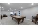 Finished basement with pool table, bar stools, sectional sofa and television at 1979 Lunenburg Dr, Westfield, IN 46074