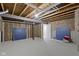 Unfinished basement with exposed ceiling and ping pong tables at 1979 Lunenburg Dr, Westfield, IN 46074