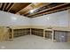 Unfinished basement with workbench and pegboard wall for storage and projects at 1979 Lunenburg Dr, Westfield, IN 46074