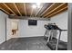 Unfinished basement with exercise equipment and view of billiards room in the background at 1979 Lunenburg Dr, Westfield, IN 46074