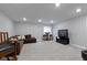 Finished basement featuring cozy seating, a table with stools, and a modern television setup at 1979 Lunenburg Dr, Westfield, IN 46074