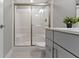 Bathroom with a shower and glass door, modern sink, and vanity at 1979 Lunenburg Dr, Westfield, IN 46074
