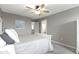 Bedroom featuring gray carpet, ceiling fan, a bathroom and a window at 1979 Lunenburg Dr, Westfield, IN 46074