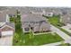 Well-maintained two-story home with a beautifully landscaped yard, covered porch, and attached two car garage at 1979 Lunenburg Dr, Westfield, IN 46074