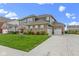 Lovely two-story home with brick and siding, well-maintained lawn and landscaping, plus a two-car attached garage at 1979 Lunenburg Dr, Westfield, IN 46074