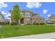 Charming two-story home with brick and siding, a beautiful lawn, and a welcoming front porch at 1979 Lunenburg Dr, Westfield, IN 46074