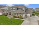 Beautiful front exterior of the home, with its attached garage, landscaped yard, and welcoming front porch at 1979 Lunenburg Dr, Westfield, IN 46074
