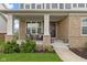 Inviting front porch with seating, showcasing the brick facade and entrance at 1979 Lunenburg Dr, Westfield, IN 46074