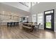 Bright great room with open floorplan, wood floors, dining area and kitchen at 1979 Lunenburg Dr, Westfield, IN 46074