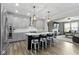 Spacious kitchen with island seating, stainless steel appliances, and pendant lighting at 1979 Lunenburg Dr, Westfield, IN 46074