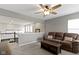 Loft area featuring a brown sofa, coffee table, and a view of the lower level, creating an inviting space at 1979 Lunenburg Dr, Westfield, IN 46074