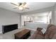 Open loft area with a brown sofa, black TV stand, view of the lower level, and ample natural light at 1979 Lunenburg Dr, Westfield, IN 46074