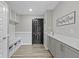 Mudroom with gray cabinets, built-in bench, and storage at 1979 Lunenburg Dr, Westfield, IN 46074