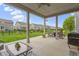 Spacious covered patio with seating, dining area, and backyard views at 1979 Lunenburg Dr, Westfield, IN 46074