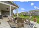 Backyard patio with firepit and covered area offering scenic views of the neighborhood at 1979 Lunenburg Dr, Westfield, IN 46074