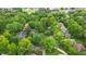 Picturesque aerial view of the home nestled among lush green trees in a serene neighborhood at 2011 Pin Oak Ct, Indianapolis, IN 46260