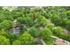 Gorgeous aerial view of a home with mature trees, landscaping, and proximity to area businesses at 2011 Pin Oak Ct, Indianapolis, IN 46260