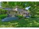 Spacious backyard featuring a large deck and screened-in porch, ideal for outdoor entertaining at 2011 Pin Oak Ct, Indianapolis, IN 46260