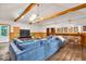 Spacious basement featuring a bar, comfortable seating, and natural light at 2011 Pin Oak Ct, Indianapolis, IN 46260