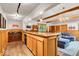 Basement with a bar area, wood paneling, and comfortable seating area at 2011 Pin Oak Ct, Indianapolis, IN 46260