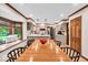 Spacious eat-in kitchen with modern appliances, island with seating, and connecting dining area near a window at 2011 Pin Oak Ct, Indianapolis, IN 46260