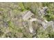 Aerial shot of the property showcasing a spacious home nestled amongst trees at 2308 Galahad Dr, Indianapolis, IN 46228