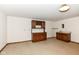 Finished basement area with built-in bar and carpeted flooring at 2308 Galahad Dr, Indianapolis, IN 46228