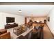 Spacious basement living room with a wet bar, a billiards table, and a large flatscreen television at 2308 Galahad Dr, Indianapolis, IN 46228