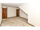 Spacious carpeted bedroom featuring two wooden doors and ample natural light at 2308 Galahad Dr, Indianapolis, IN 46228