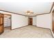 Spacious bedroom with ceiling fan, closet, and an adjoining bathroom for easy access at 2308 Galahad Dr, Indianapolis, IN 46228