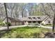 Charming home with a well-manicured lawn, complemented by a circular driveway and attached three-car garage at 2308 Galahad Dr, Indianapolis, IN 46228