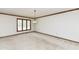 Cozy living room with plush carpeting, a chandelier, and well-lit windows at 2308 Galahad Dr, Indianapolis, IN 46228
