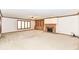 Cozy living room showcases a fireplace, built-in shelving, and bright windows at 2308 Galahad Dr, Indianapolis, IN 46228