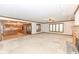 Open concept living room offering a view of kitchen and large windows to bring in light at 2308 Galahad Dr, Indianapolis, IN 46228
