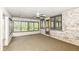 Charming sunroom with brick accents, light-filled windows, and an open layout at 2308 Galahad Dr, Indianapolis, IN 46228