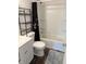 Cozy bathroom featuring a shower, toilet, vanity, and a classic design at 2632 Walker Ave, Indianapolis, IN 46203