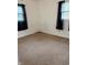 Comfortable bedroom with neutral carpet, windows for natural light, and ample space at 2632 Walker Ave, Indianapolis, IN 46203