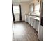 Efficient kitchen design with ample counter space, modern appliances, and wood laminate floors at 2632 Walker Ave, Indianapolis, IN 46203
