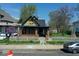 Charming home featuring a cozy front porch and classic architectural details at 3320 E New York St, Indianapolis, IN 46201
