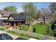 A well-maintained house with front yard, showcasing curb appeal and neighborhood charm at 3320 E New York St, Indianapolis, IN 46201