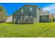 Large backyard showcasing a well-maintained lawn, wooden deck, and beautiful exterior of the home at 358 W Tansey Xing, Westfield, IN 46074