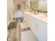 Bright bathroom featuring a double vanity with white cabinetry, framed mirror, and tiled accents at 358 W Tansey Xing, Westfield, IN 46074
