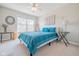 Cozy bedroom with natural light, featuring neutral walls and carpet, and bright blue accents at 358 W Tansey Xing, Westfield, IN 46074