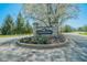 Welcome to Springmill Villages! Stone entrance sign surrounded by colorful flowers and lush greenery at 358 W Tansey Xing, Westfield, IN 46074