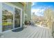 Inviting outdoor deck with seating area, potted plants, and sliding glass door access to the home at 358 W Tansey Xing, Westfield, IN 46074