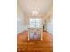 Charming dining room with wainscoting, bright light fixture, and natural light at 358 W Tansey Xing, Westfield, IN 46074