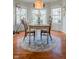 Light-filled dining room features a decorative light fixture and sliding doors to the outside at 358 W Tansey Xing, Westfield, IN 46074