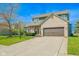 Beautiful two-story home with a two-car garage, manicured lawn and charming curb appeal at 358 W Tansey Xing, Westfield, IN 46074