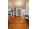 Bright hallway with hardwood floors leads to various rooms in the home at 358 W Tansey Xing, Westfield, IN 46074
