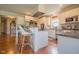 Functional kitchen layout with white cabinets, granite counters, stainless appliances, and center island at 358 W Tansey Xing, Westfield, IN 46074